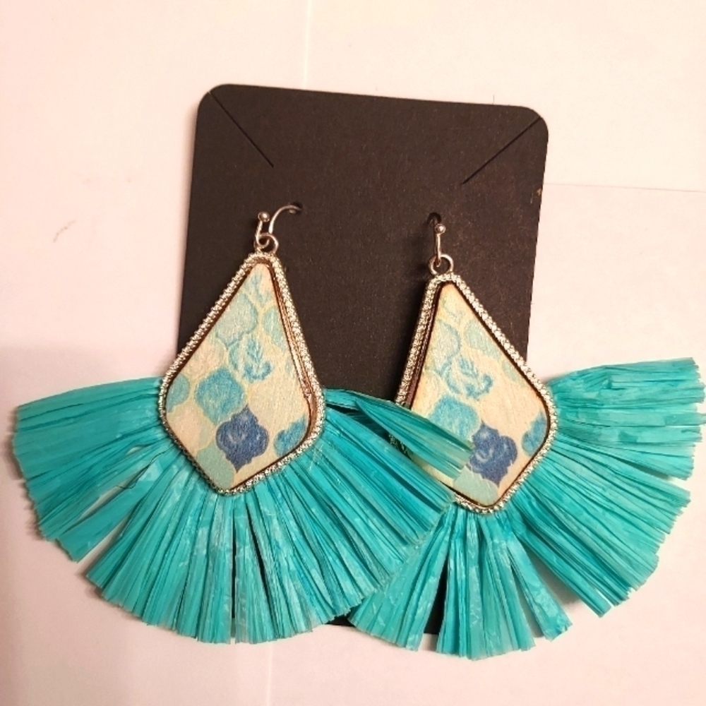 Light blue silver tone fan earrings.